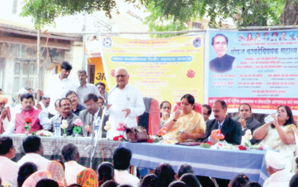 Justice Shri.B.G.Kolse Patil, Former Judge, Bombay High Court addressing villagers in the Legal Aid Camp at Pargaon Sudrik, Tal.Srigonda and Smt. Suvarna Kewale, District Judge with other dignitaries